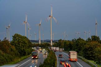To safeguard global public goods, high-income countries must make their economies sustainable: windfarm and motorway in Germany. 