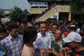 Supporters greet president-elect Joko Widodo (centre) in Surabaya in late July.