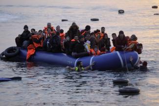 Refugees reach the Greek island of Lesbos.