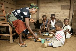 A grandmother in Cameroon taking care of AIDS orphans.