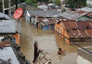The poor are the most vulnerable: a flooded informal settlement  hit by Hurricane Sandy in Santo Domingo in October 2012.