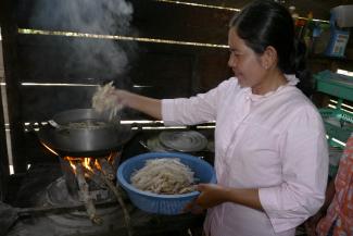 A woman cooking at home in Cambodia’s Stung Treng District.
