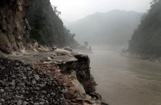 Mountain road damaged by flashfloods in North India in June.