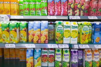 Much food is wasted in processing and consumption: tropical fruit juice in a British supermarket.