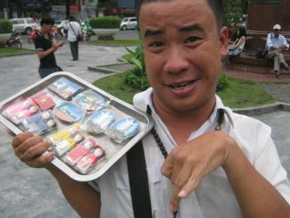 Agent-orange victim selling souvenirs in Ho-Chi-Minh-City: people with disabilities tend to be marginalised.