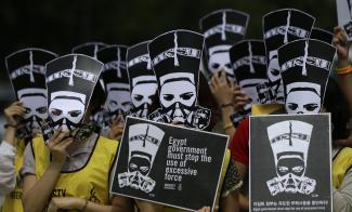 Globale Reichweite: Amnesty-International-Aktivisten demonstrierten in Seoul im September gegen die Gewalt der ägyptischen Sicherheitskräfte .