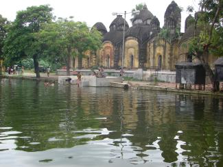 Shiva temples on the banks of Chatterjee Para Pond.