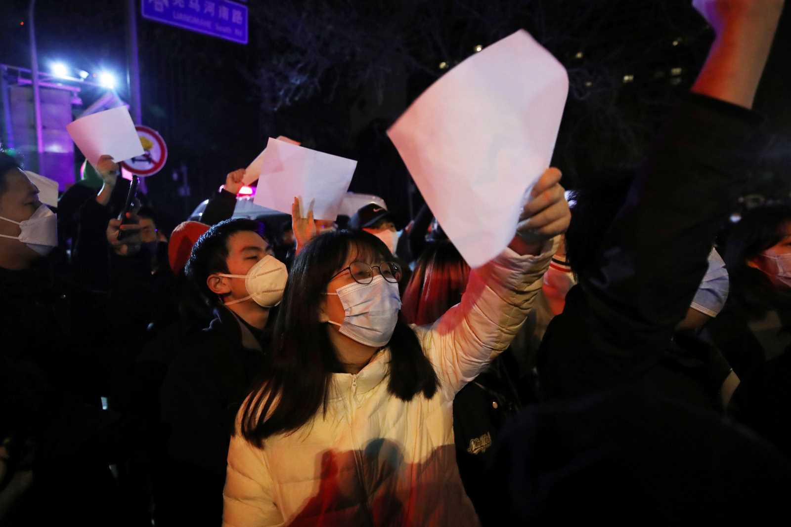 Blank pages stood for no freedom of speech: protesters in Beijing in late November. 