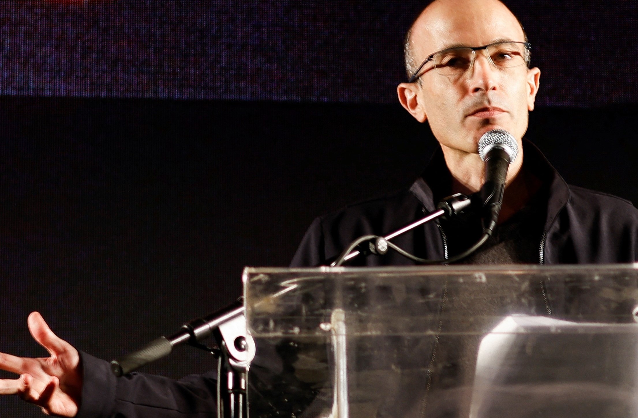 picture alliance / REUTERS / Amir Cohen Yuval Noah Harari addressing a protest March – The Guardian published his speech in its opinion section.