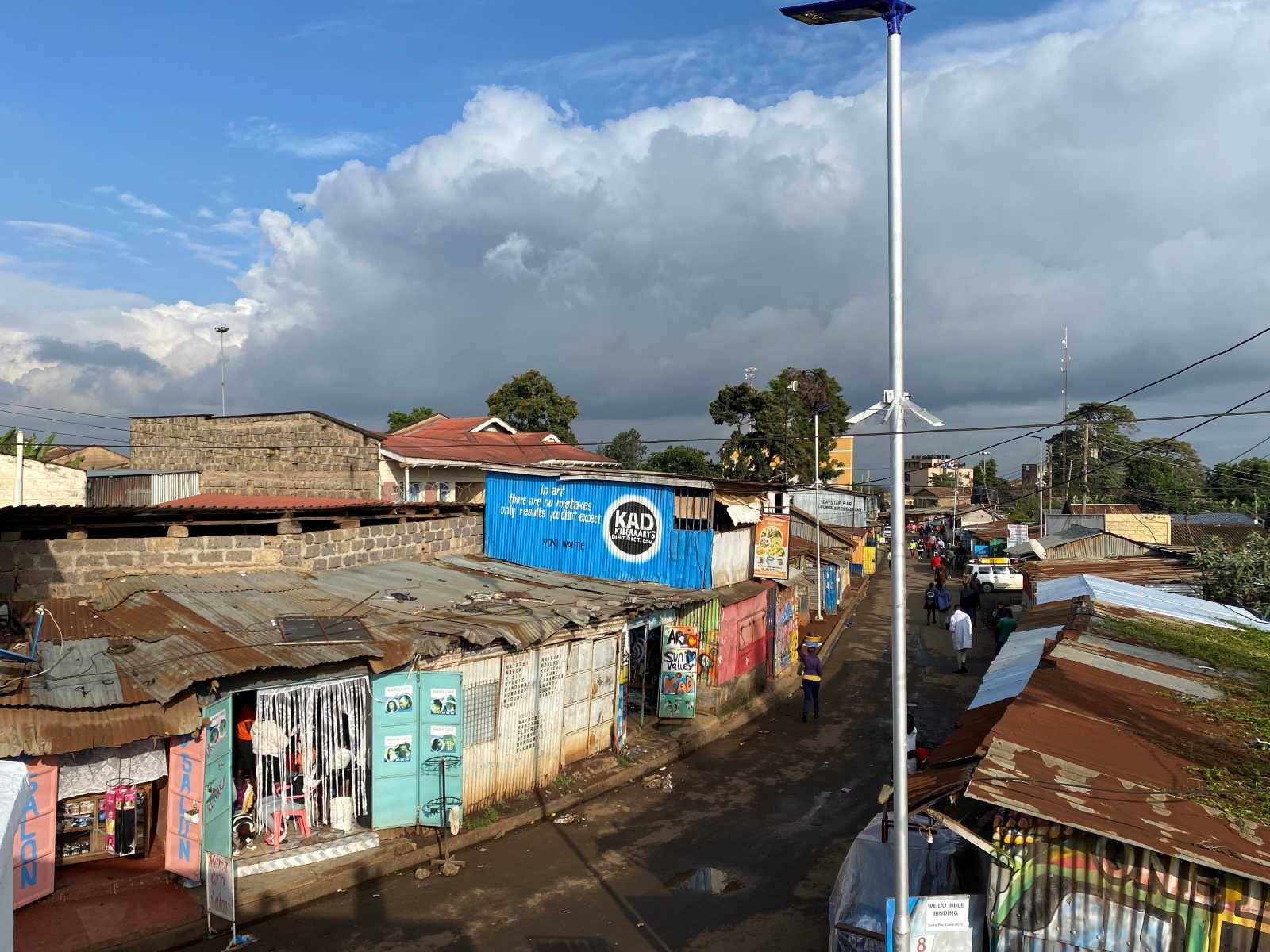 View of the Kibera Arts District from the roof of the main gallery. Most of the workshops and studios are located along the “main street”.