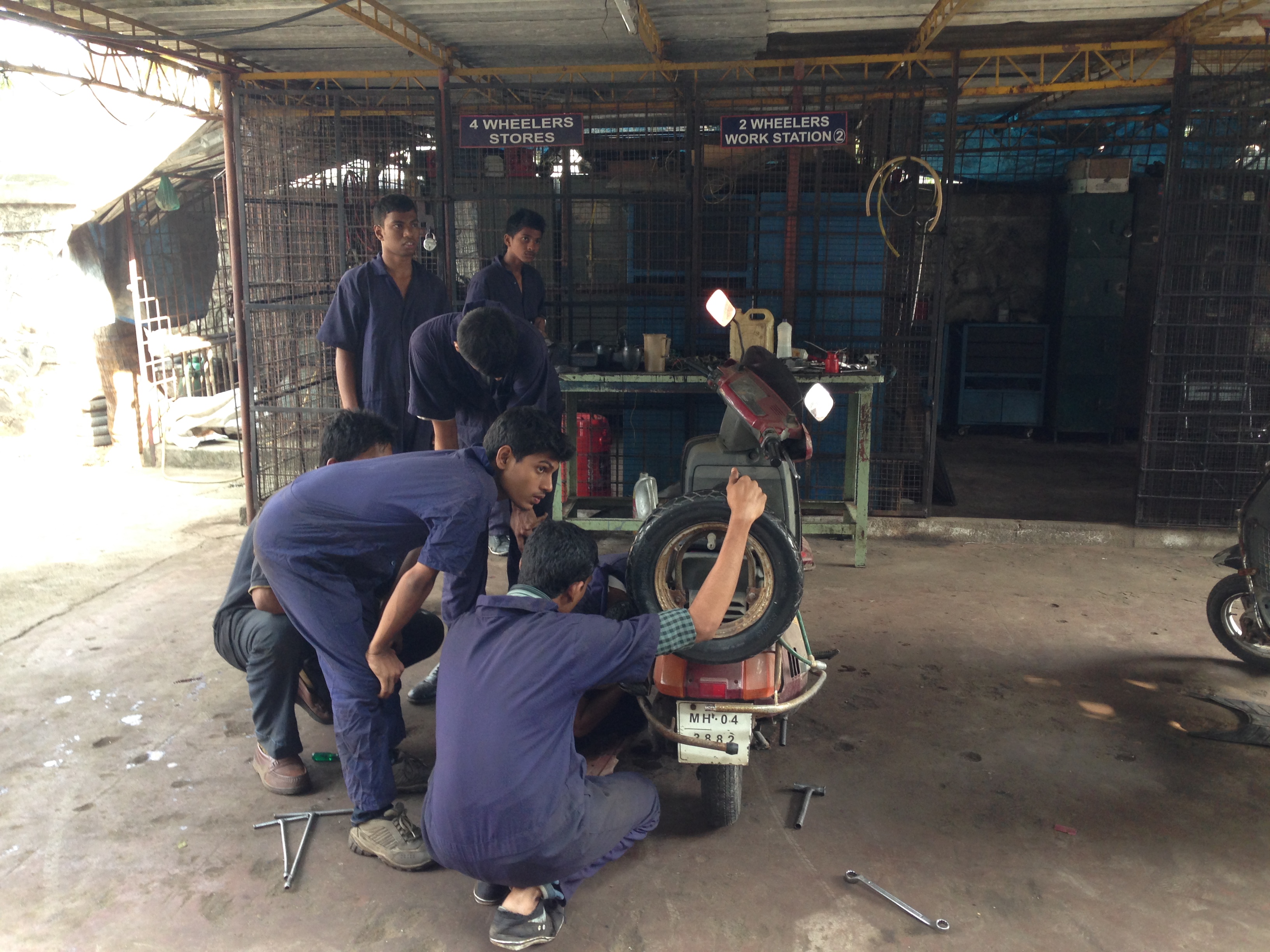 Ute Lange Learning to repair motor scooters.