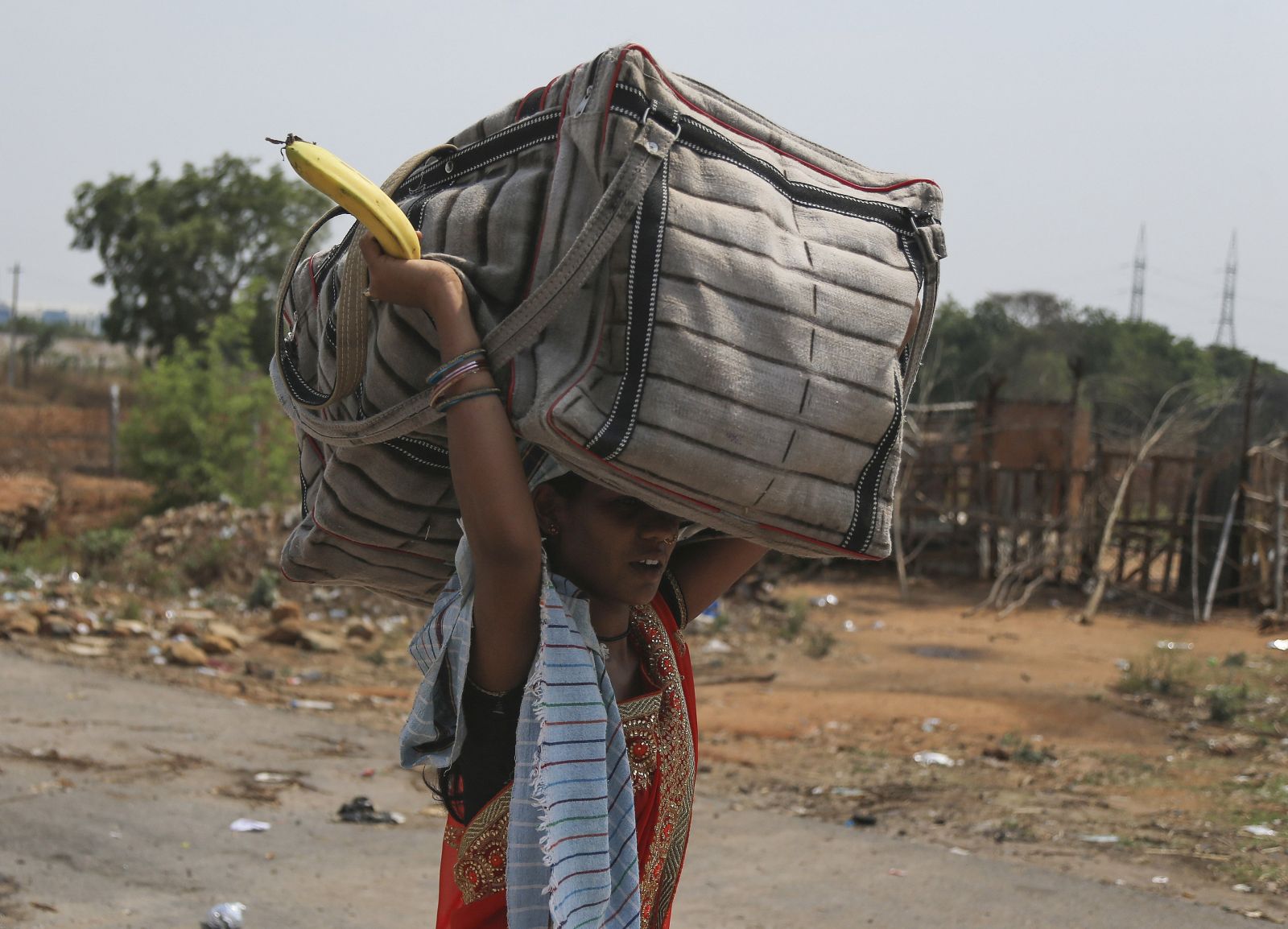 Mahesh Kumar A/picture-alliance/ASSOCIATED PRESS Walking home: a migrant worker leaving Hyderabad in early May
