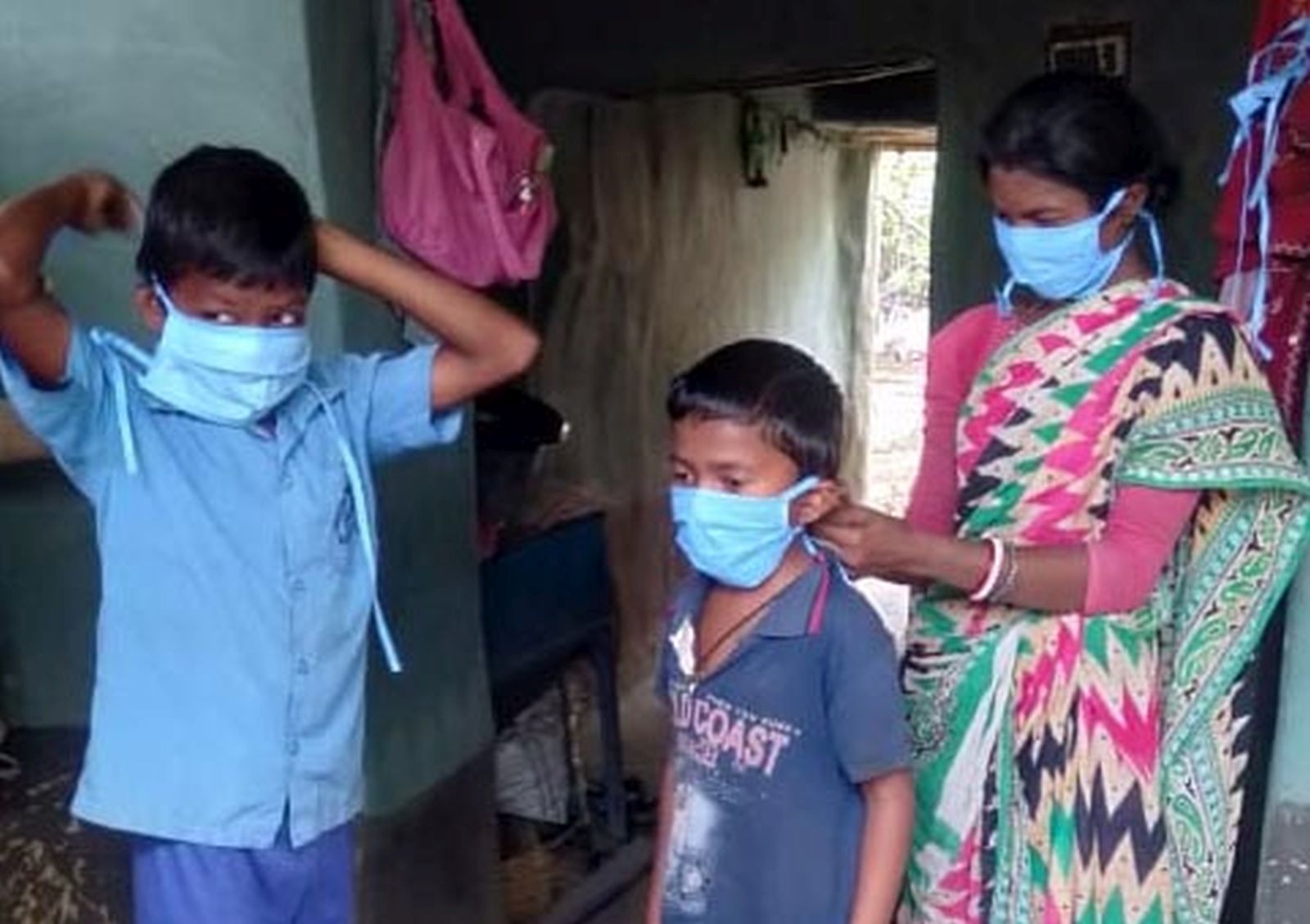 Boro Baski Putting on masks before going outside.