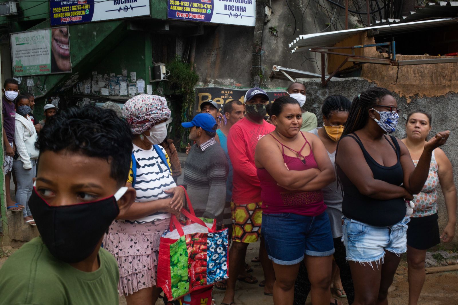 Not much space for social distancing: favela residents waiting for food supplied by a non-governmental activist.