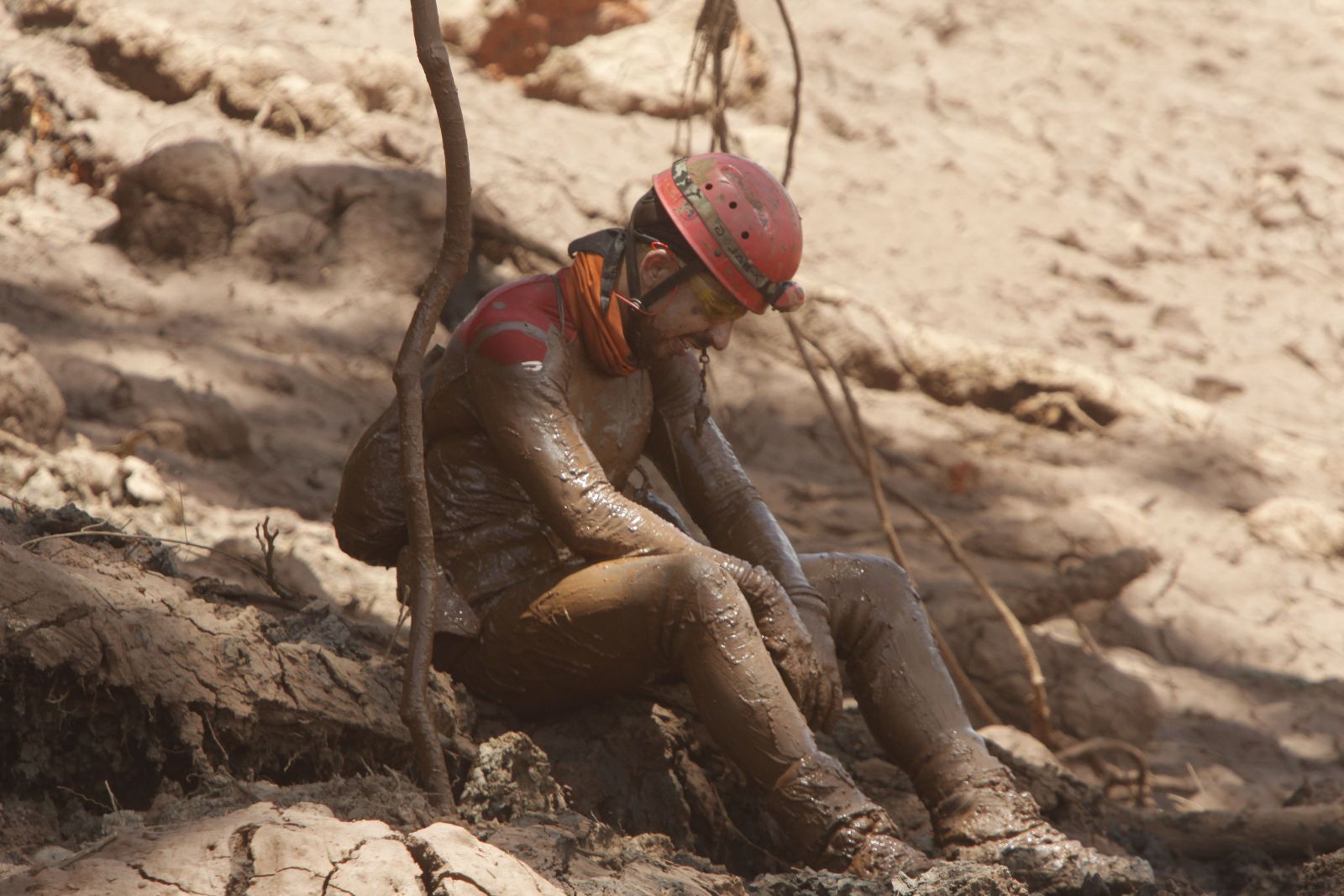 Exhausted rescue worker in Brumadinho.