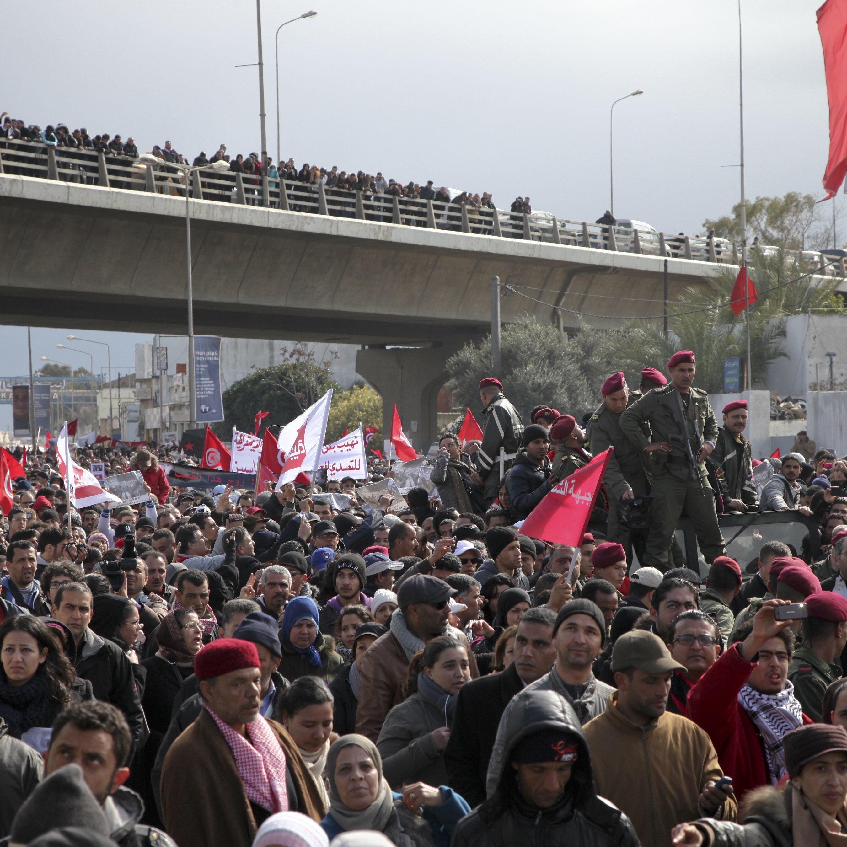 picture-alliance/dpa Democracy could yet prevail: people attending the funeral of Chokri Belaid, the assassinated trade-union leader, earlier this year.