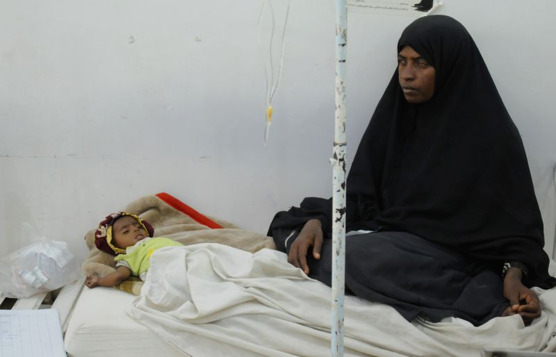The war in Yemen causes a humanitarian crisis: a mother sits by her malnourished child at a therapeutic feeding centre in Sanaa.