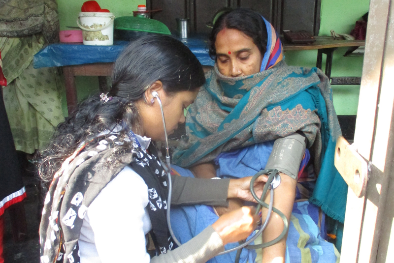 dem Paramedic providing antenatal and postnatal care on behalf of GK in a village.