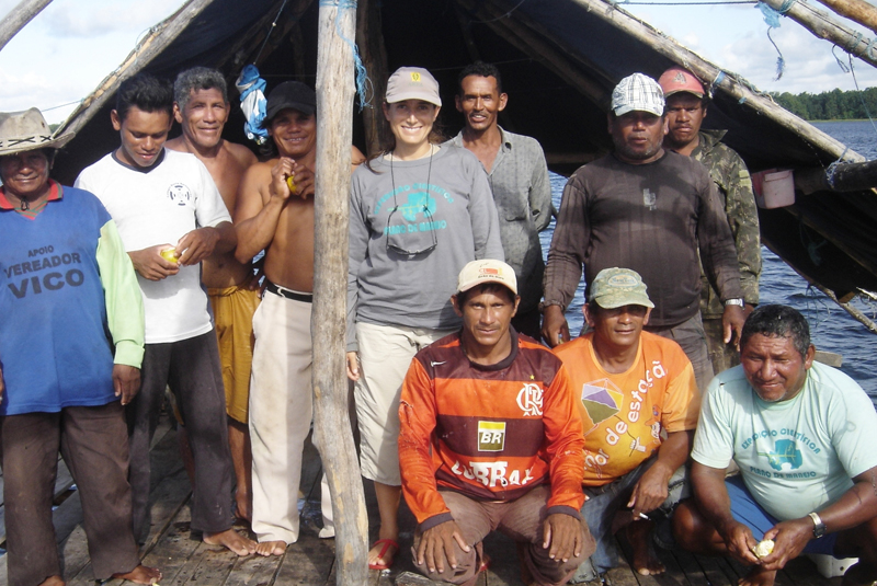 Patricia Pinha (centre) with fishers on Lake Piratuba.