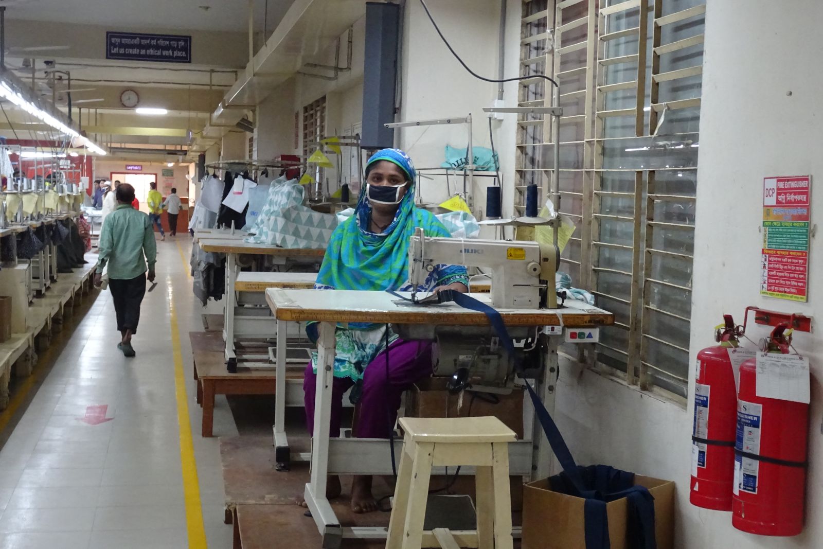 Inequality results from the current economic order, warns Oxfam: worker in Bangladeshi garment factory.