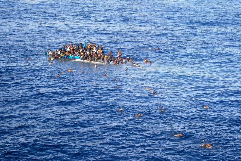 Refugees in a boat on the Mediterranean Sea.