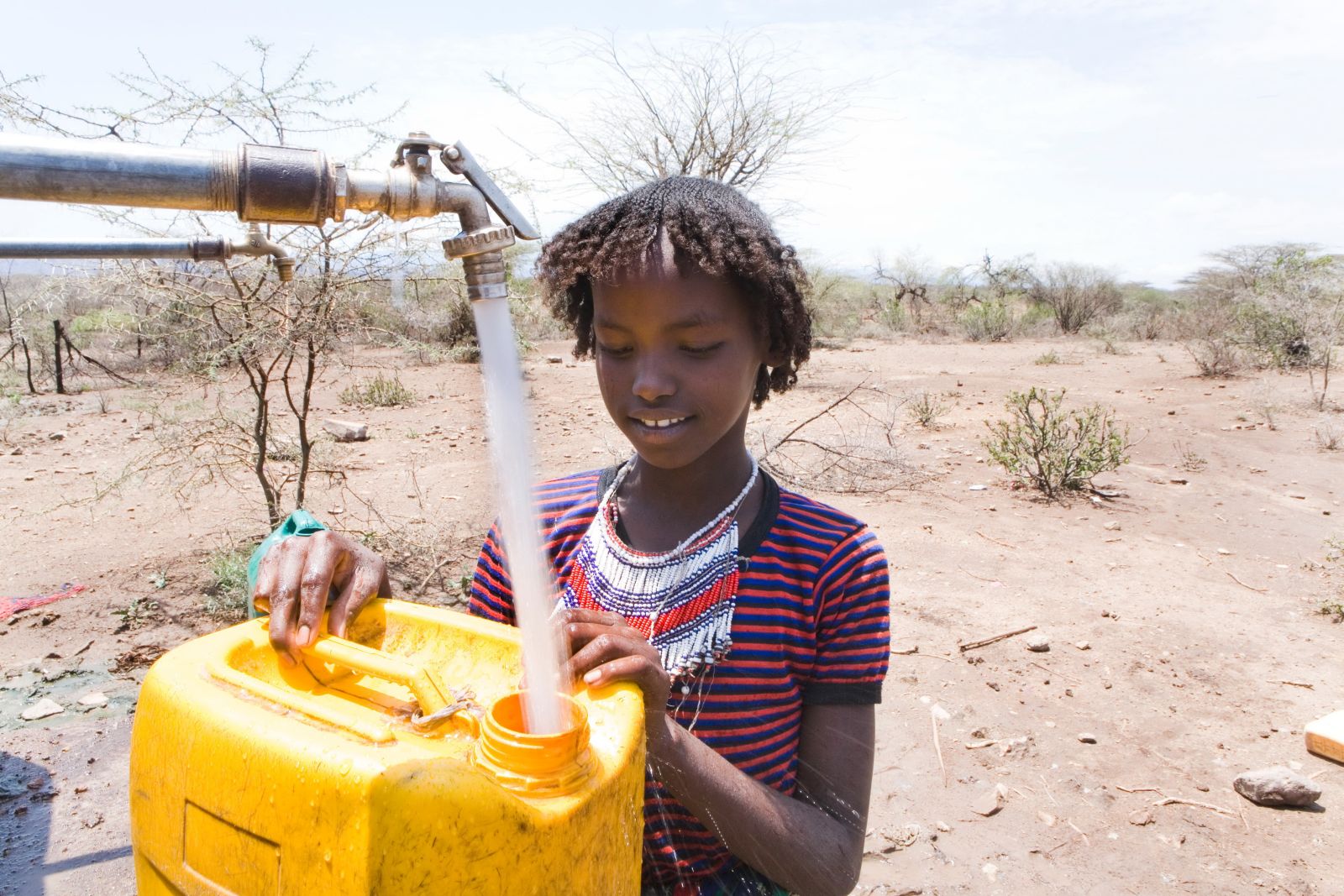 Ton Koene/Lineair Many places lack the money to finance water infrastructure: a girl collecting drinking water in Ethiopia.