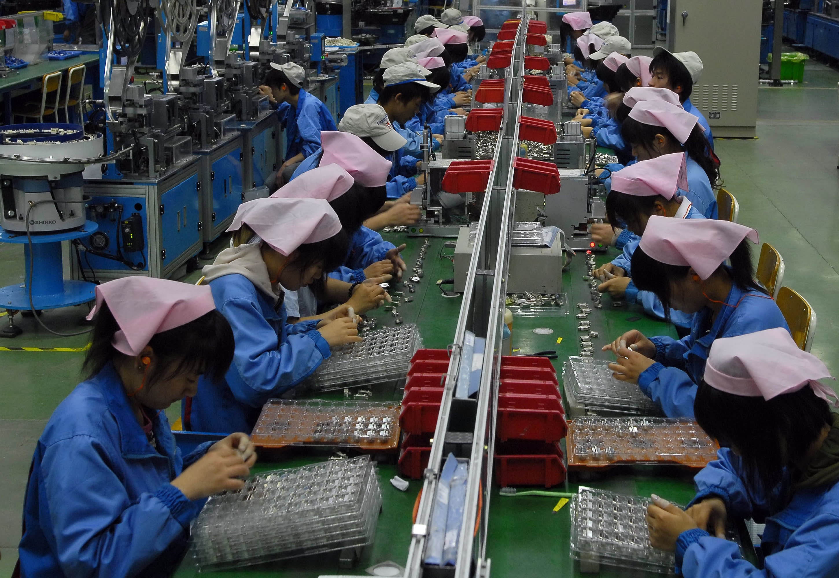 Workers at an IT factory in Huinan, China.