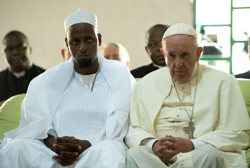 Inter-faith dialogue helps: Pope Francis visiting Bangui’s Central Mosque in November. To his right: Tidiani Moussa Naibi, the mosque’s imam.