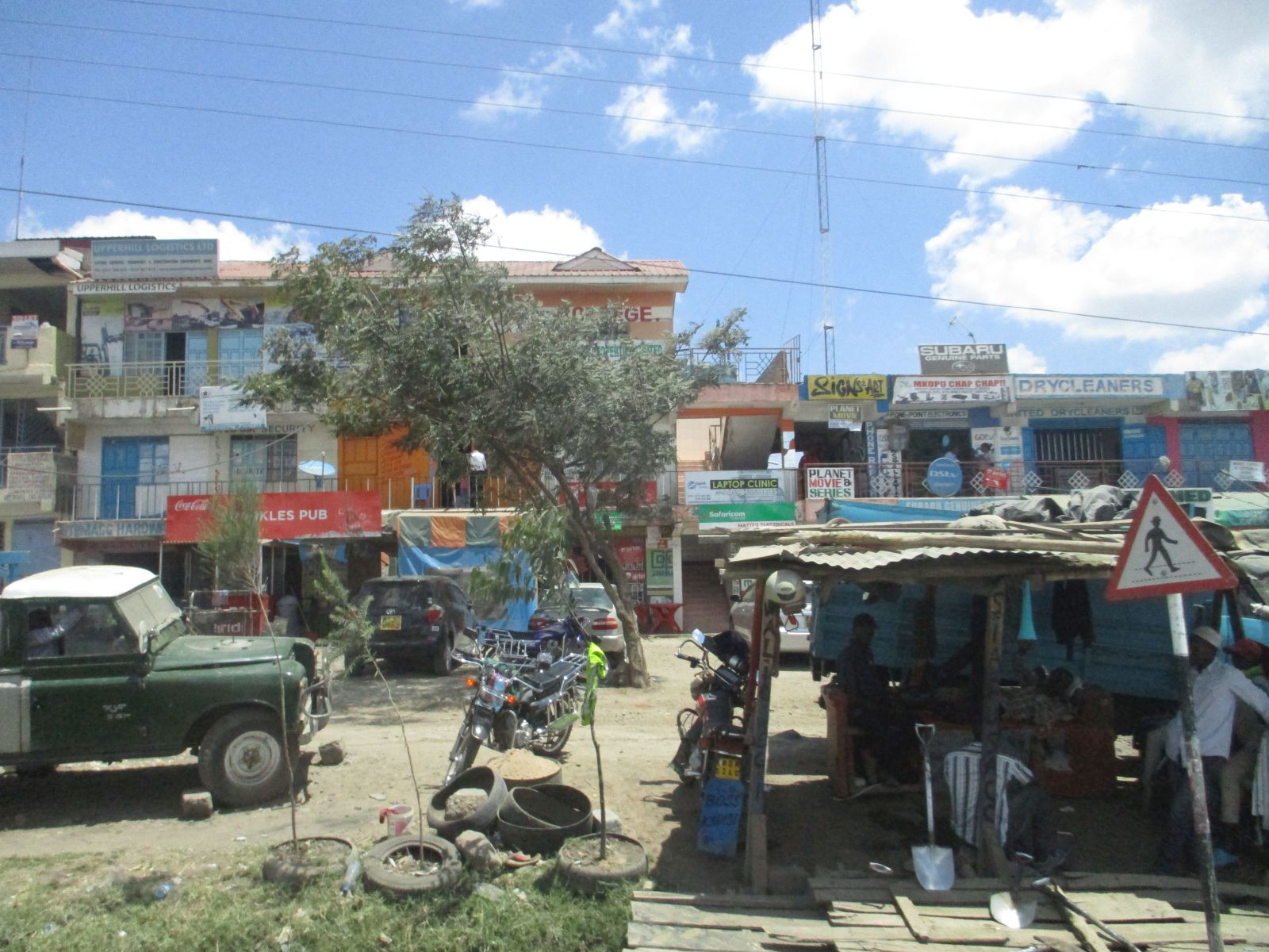Growth in itself will not solve urban infrastructure problems: small shops on the outskirts of Nairobi.
