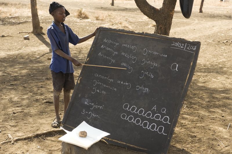 In Uganda, the cane the boy uses to show something on the blackboard is often used by teachers to discipline their pupils.