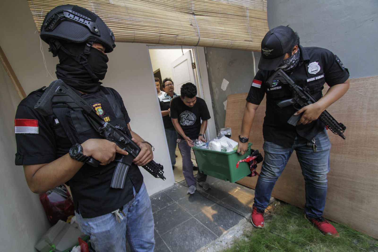 Police raiding an ecstasy lab in Bogor in 2018.