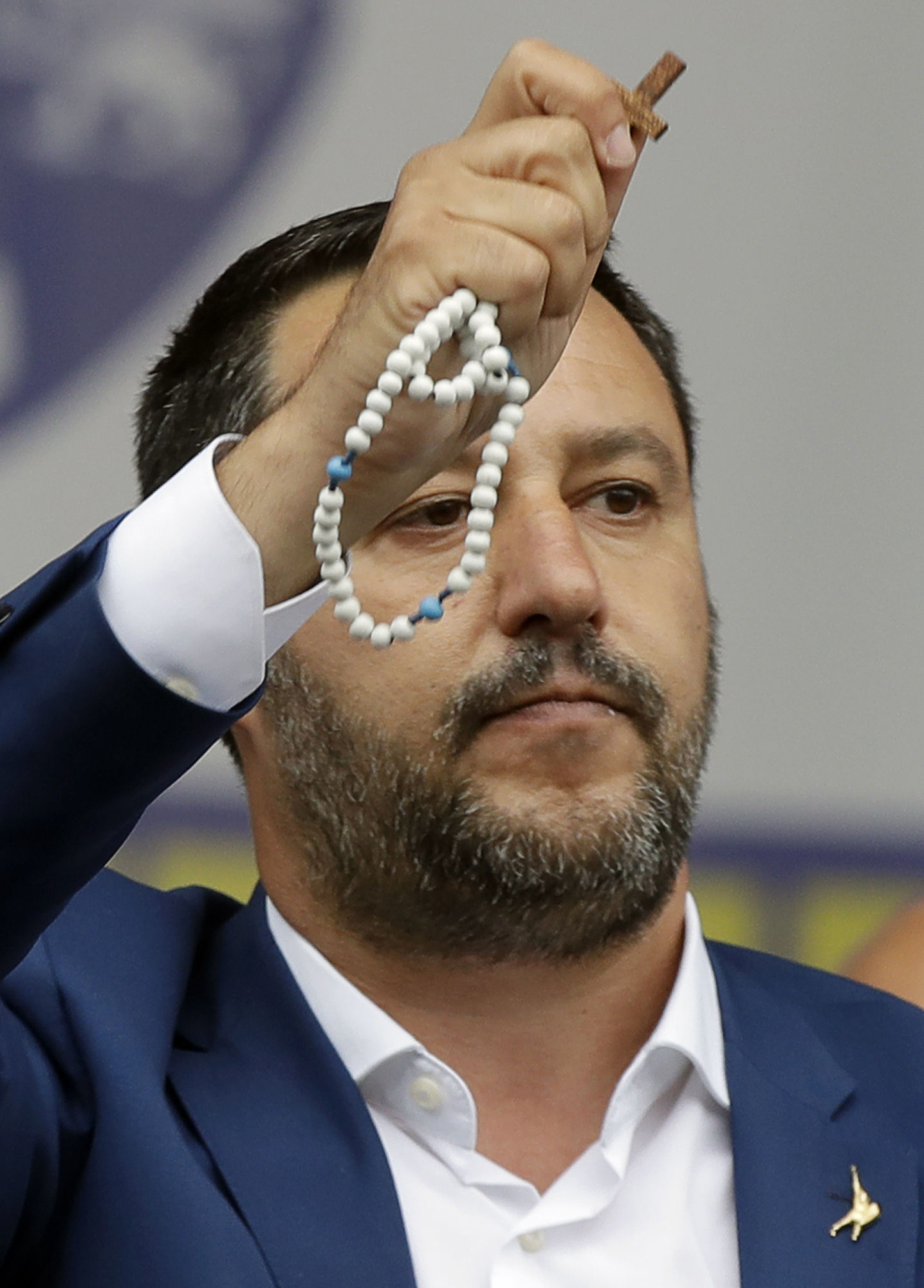 Salvini displaying a rosary.