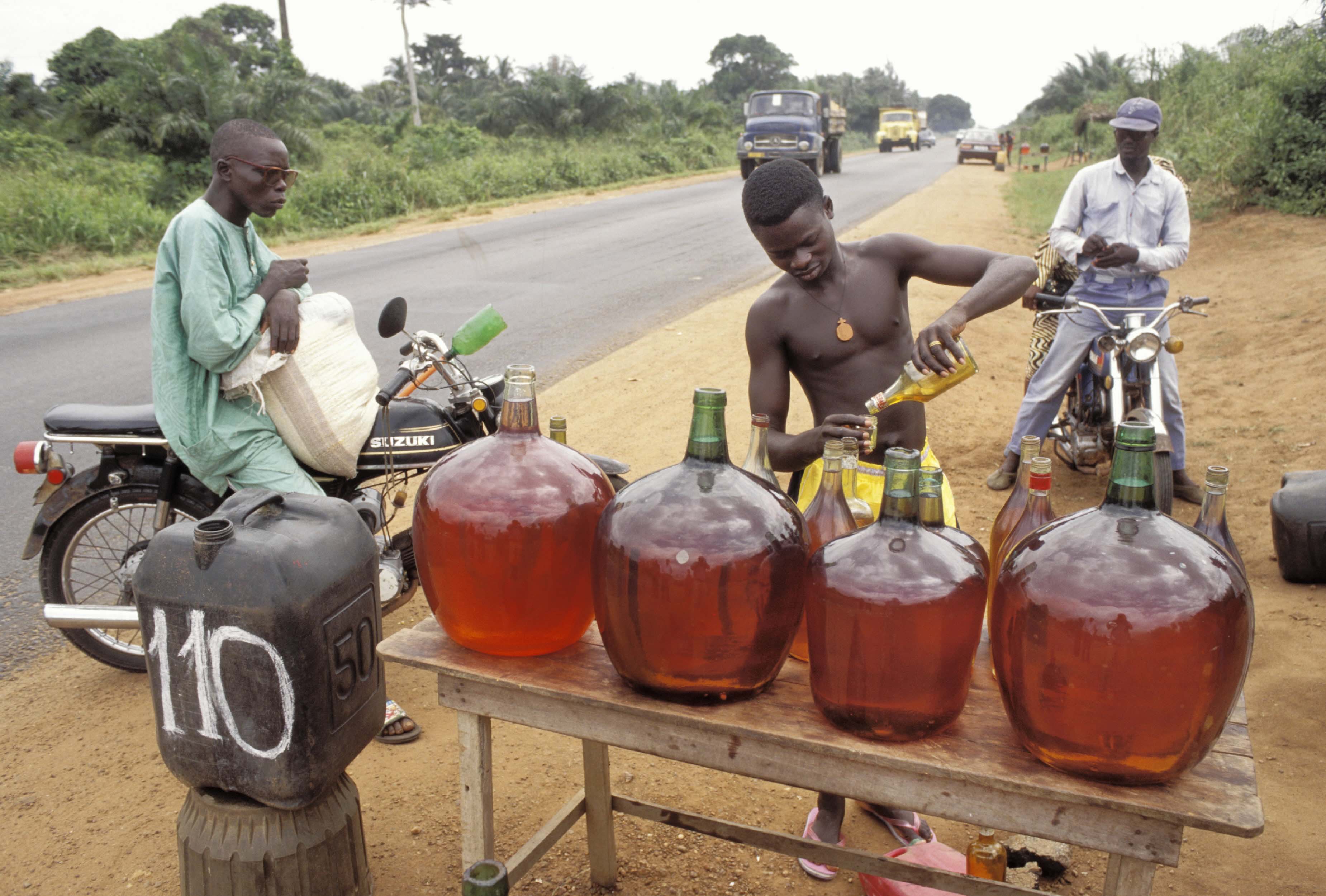 Smuggled petrol is sold on the highway between Cotonou and Porto Novo.