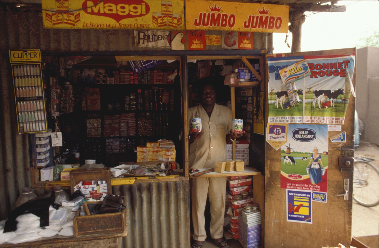 Ron Giling/Lineair A retailer in Burkina Faso sells Dutch products, including milk powder, in his small store.