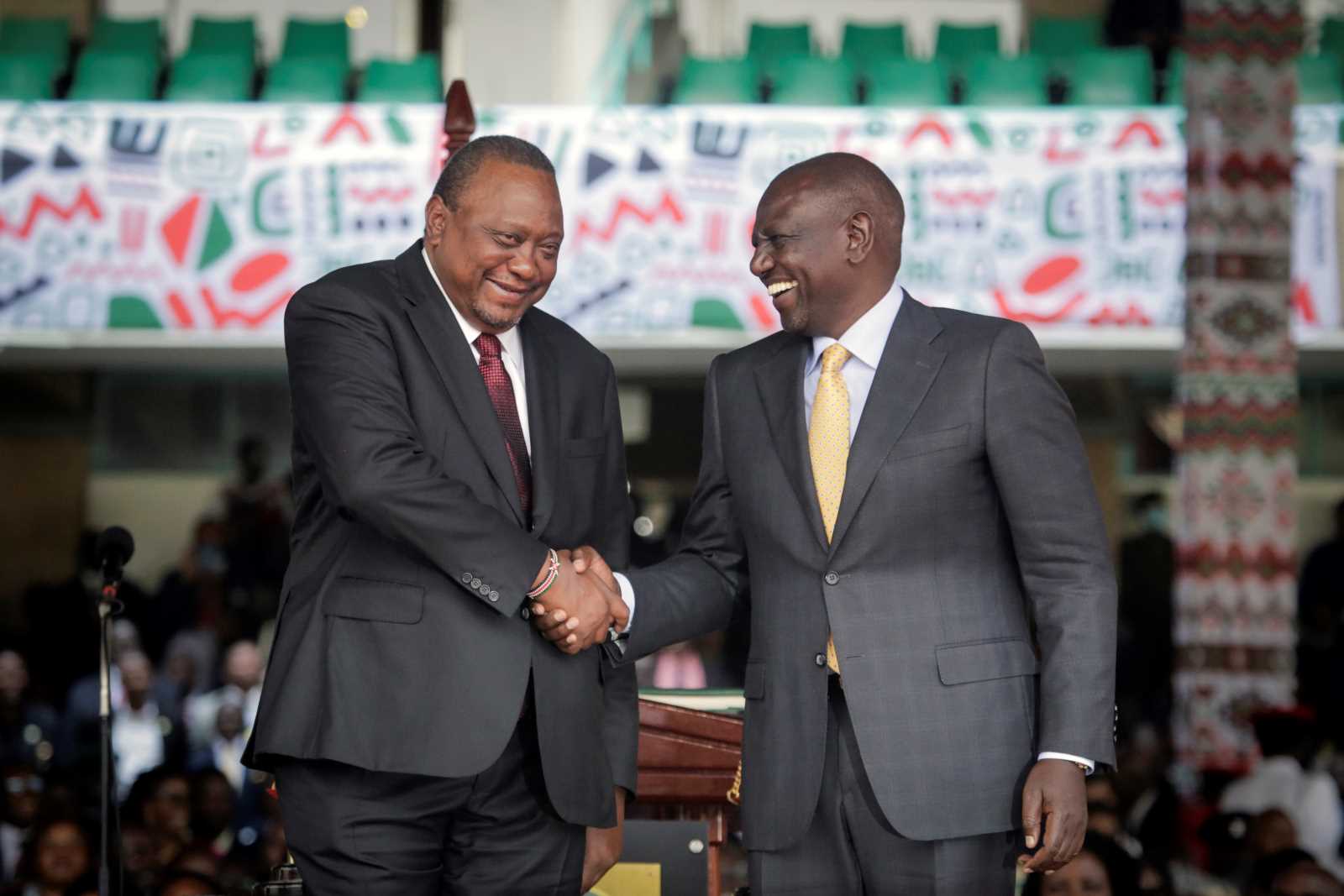 Smiles on inauguration day: President Ruto shaking hands with his predecessor and former boss Kenyatta on 13 September.