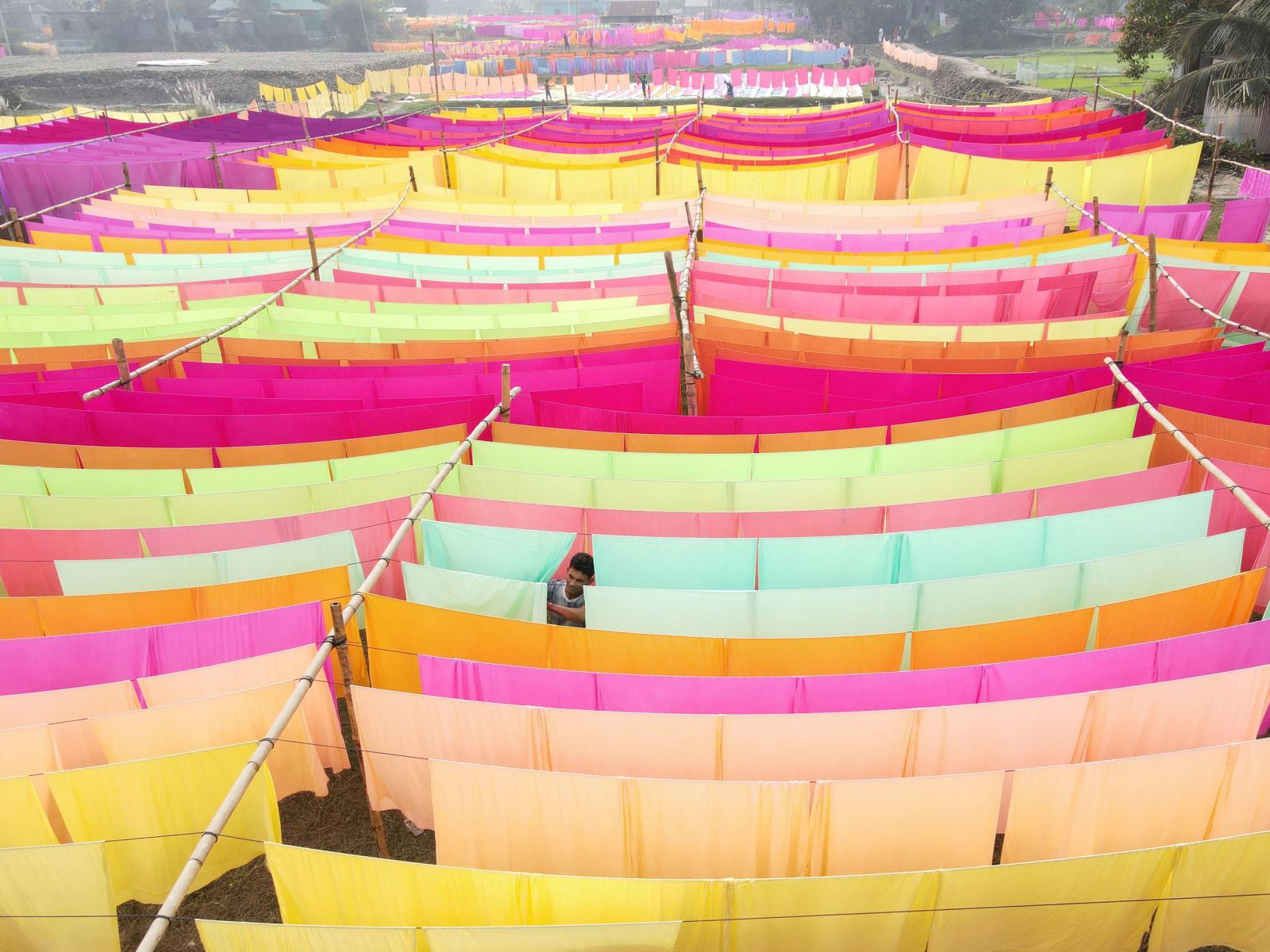 Dyeing processes typically involve over 1,600 different chemicals: drying textiles at a factory in Bangladesh.
