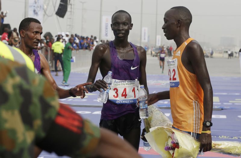 Kenyan athlete Abraham Kipton (centre) won the Lagos City Marathon in February.