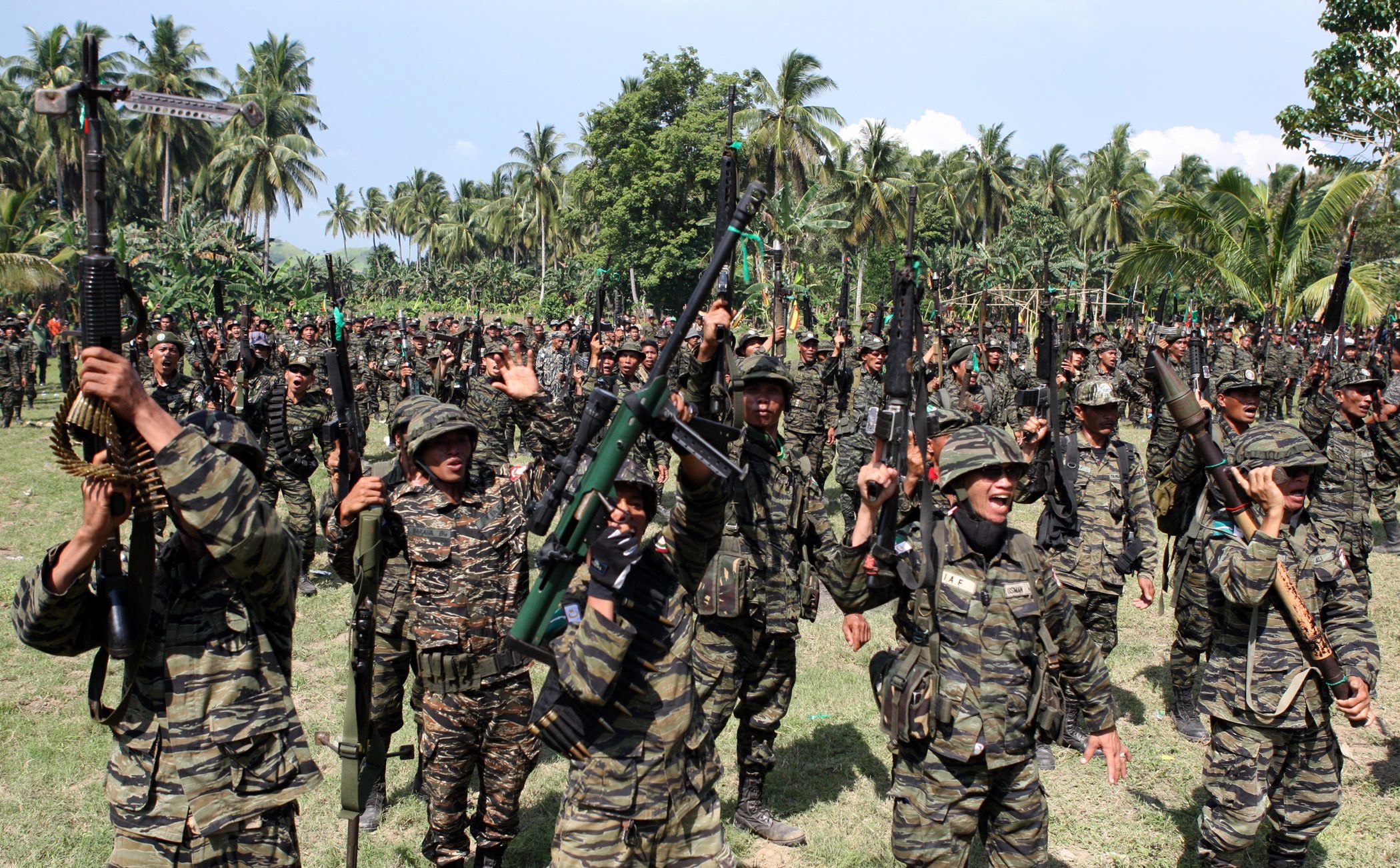 MILF fighters hail the signing of the peace agreement in October 2012.