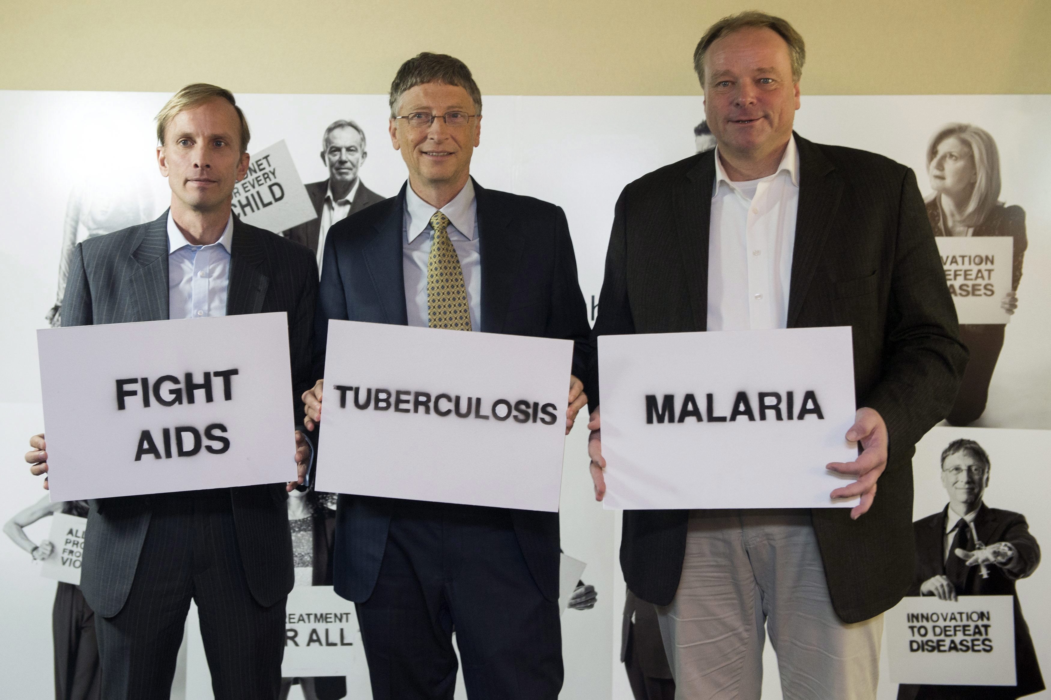 Jean-Christophe Bott/picture-alliance/dpa Shared concern: Dirk Niebel and Bill Gates with Mark Dybul, the executive director of the Global Fund to Fight AIDS, Tuberculosis and Malaria at a photo opportunity during the World Economic Forum in Davos in January 2013.