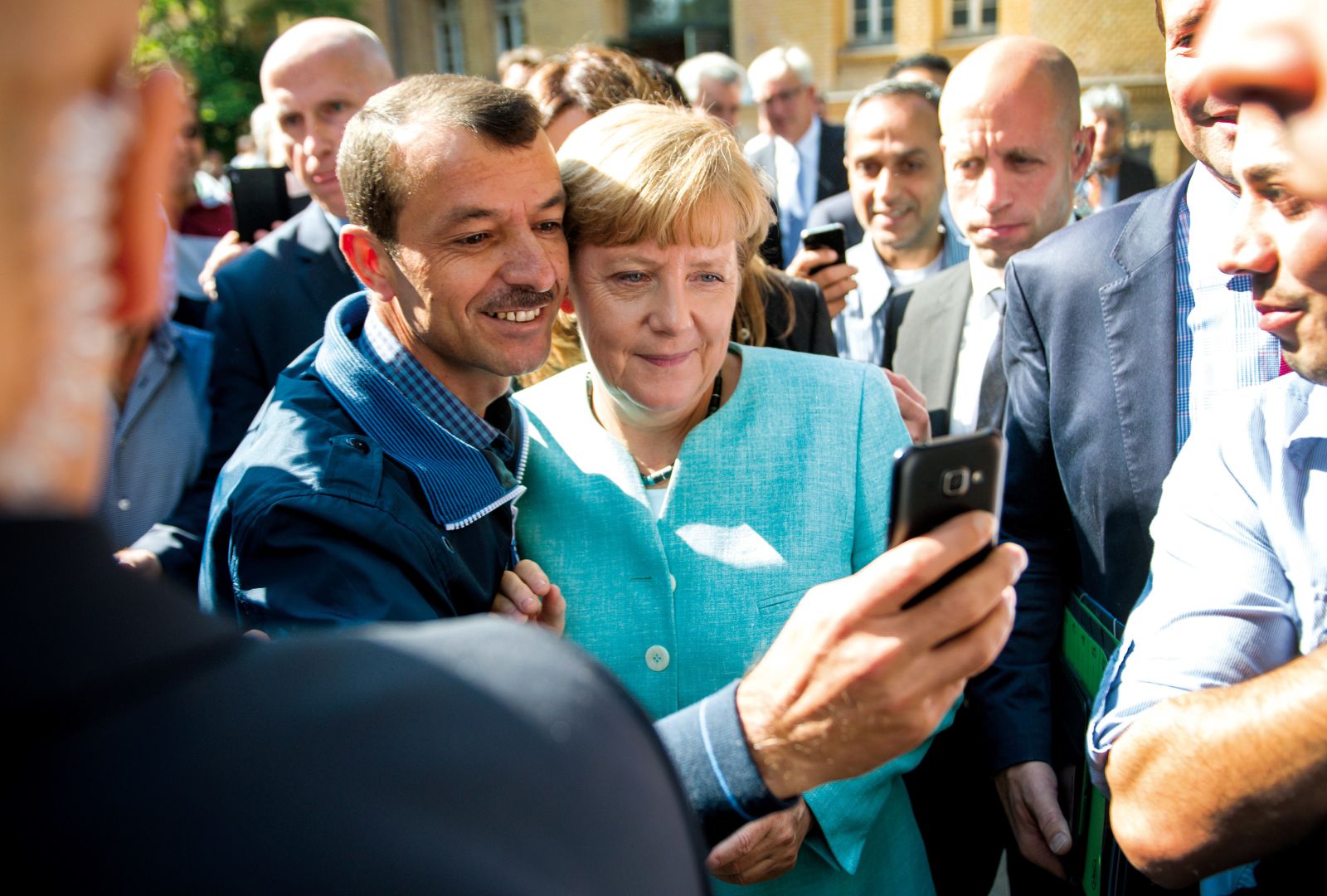 Images like this one have boosted Germany’s reputation: a refugee taking a selfie with chancellor Angela Merkel.