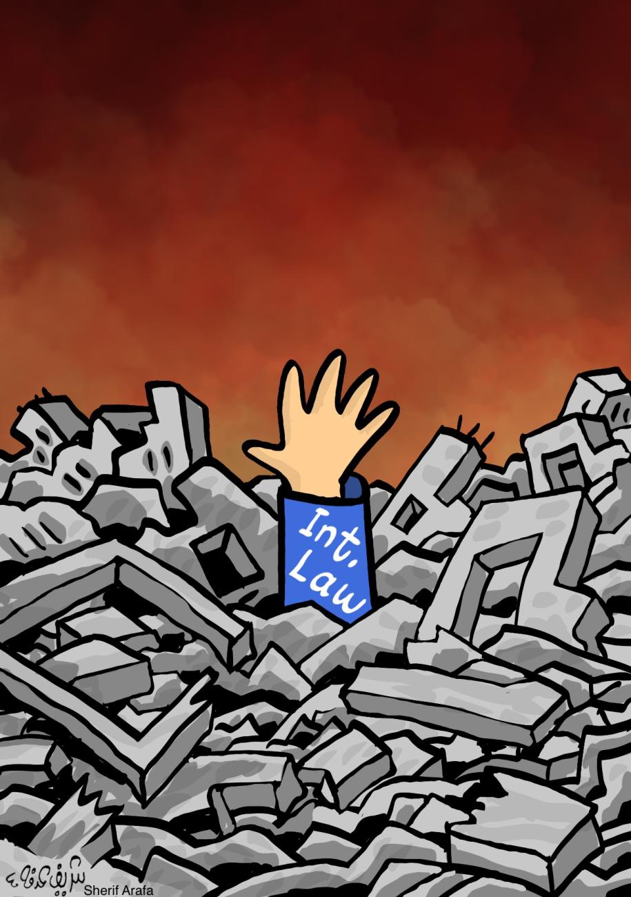 Cartoon: a hand with an “Int. Law” cuff reaches out from rubble of destroyed buildings under a reddish smoky sky.