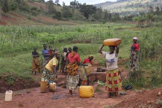 Ton Koene The chrores of Burundian farm women include fetching water.