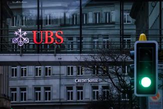 Swiss authorities made UBS take control of Credit Suisse – bank logos on different buildings in Zurich. 