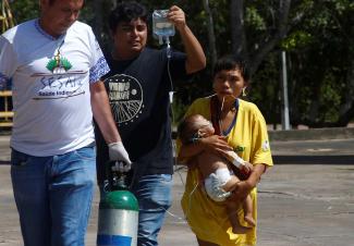 A sick Yanomami baby held by its mother was transported by plane from the Yanomami territory to receive medical treatment in Boa Vista, the capital of Roraima state, after the new Brazilian government declared a health emergency for the Yanomami people.