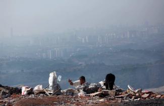 A woman collecting usable items on a landfill on the outskirts of Mexico City in 2016. 