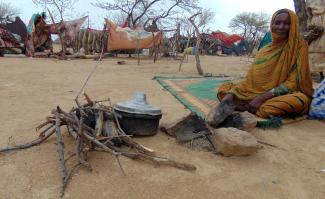 A Sudanese woman in a makeshift refugee camp in Chad’s desert.