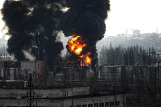 A fire rages after Russian rockets hit an oil refinery and an oil depot in Odesa, southern Ukraine, 2022.