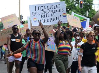 picture-alliance/REUTERS/Fariha Farooqui Members of the LGBTQ community protest at the Munich Christopher Street Day – in Uganda they might go to jail for this.