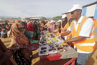 Local conventions matter: civil-society organisations in Somalia preparing the after-sunset evening meal during Ramadan in a refugee camp near Mogadishu.