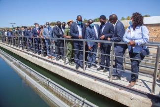 The debt has become unsustainable: President Hakainde Hichilema (3rd from right) visits Chinese-financed water infrastructure in Lusaka Province in July 2022. 